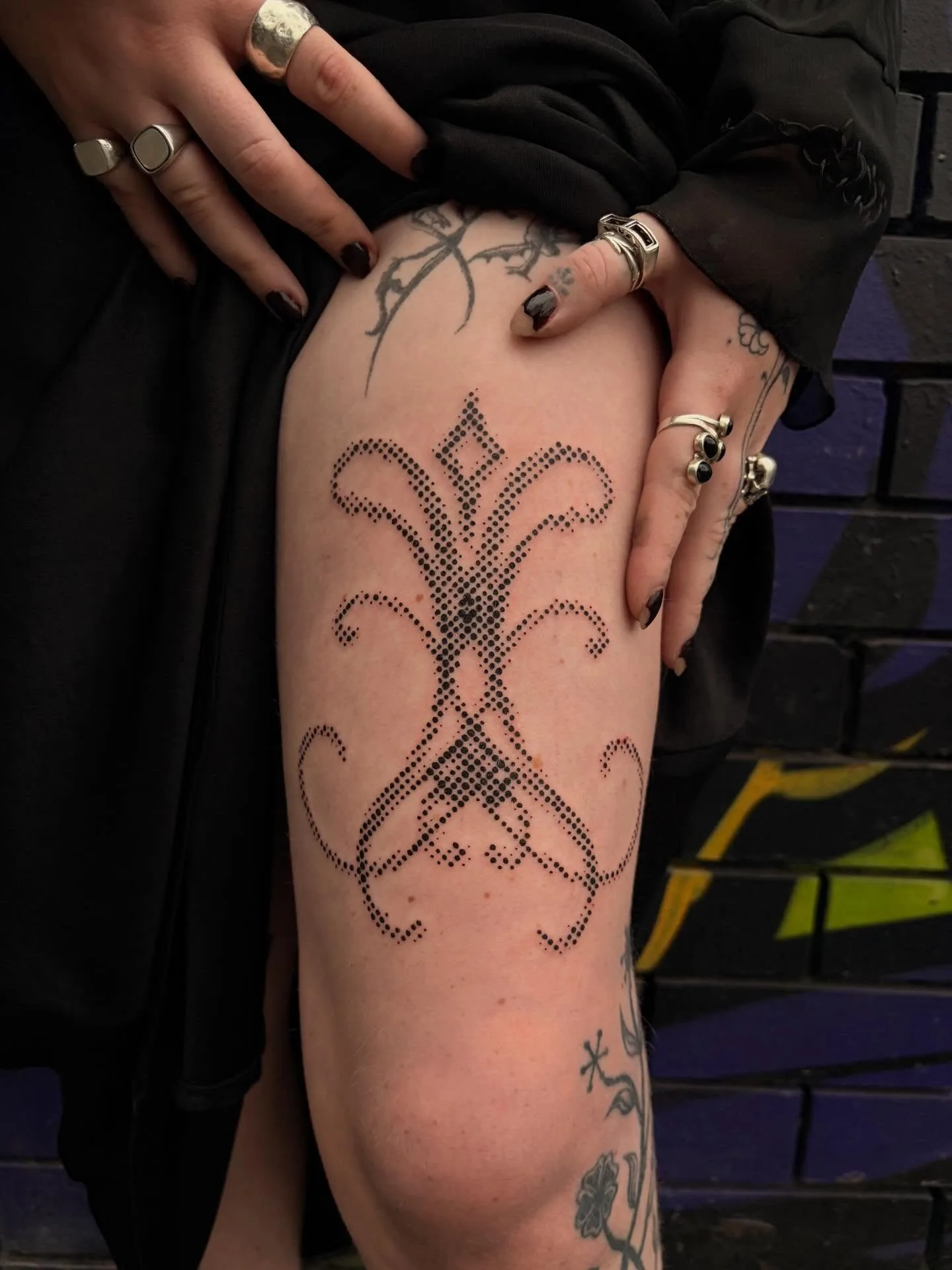 Dotwork ornamental thigh tattoo