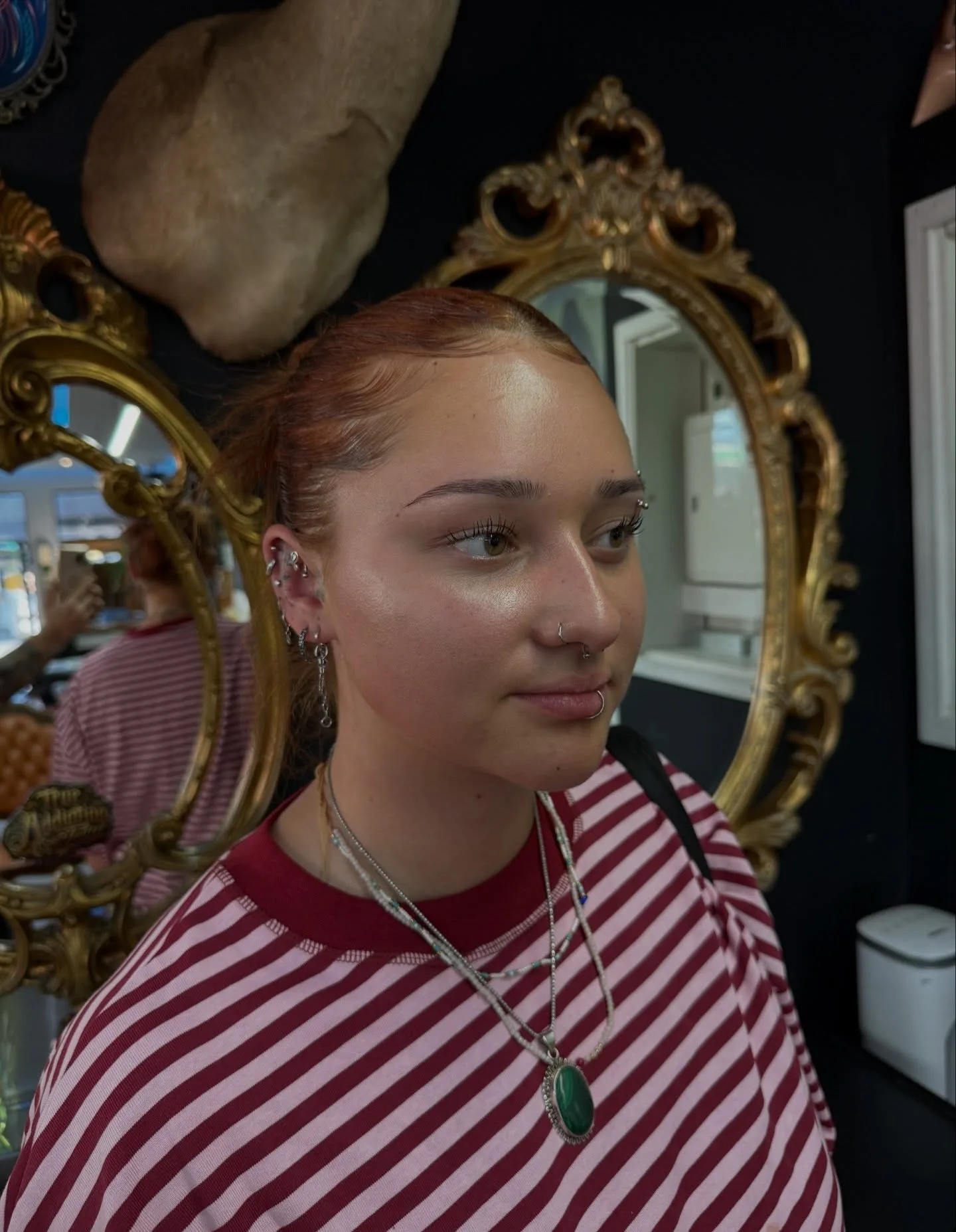 Extensive ear-stack and septum piercing portfolio shot at True Addiction