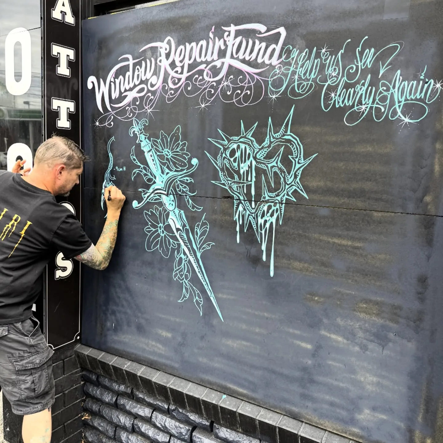 Colin Gower, owner and lead artist of True Addiction Tattoo, at the studio shopfront